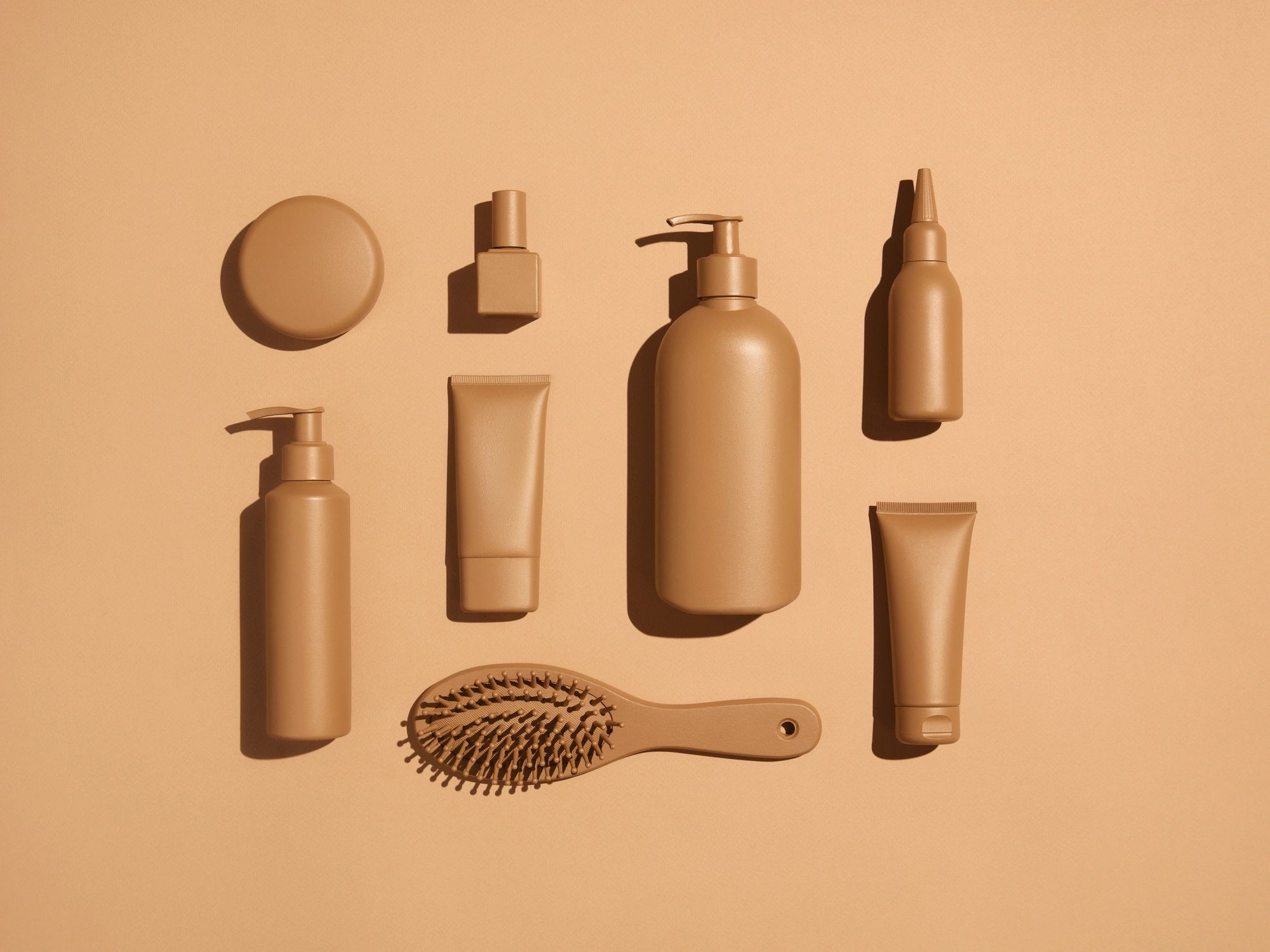 Beige-toned skincare products flat lay