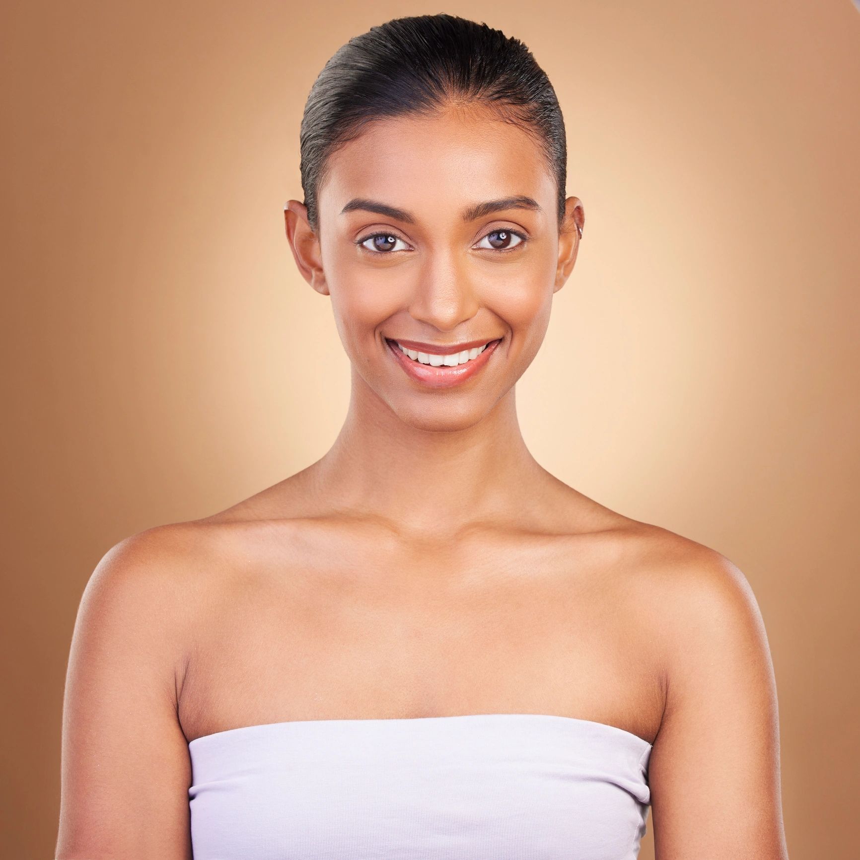Portrait of a smiling woman with glowing skin