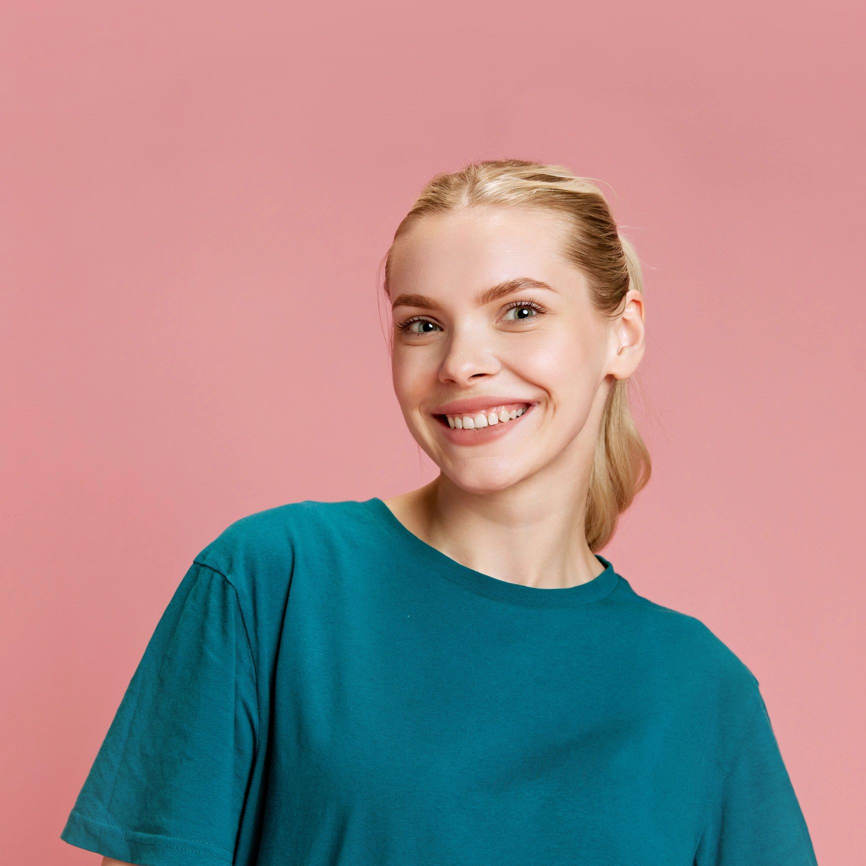 Portrait of a smiling woman on a pastel background