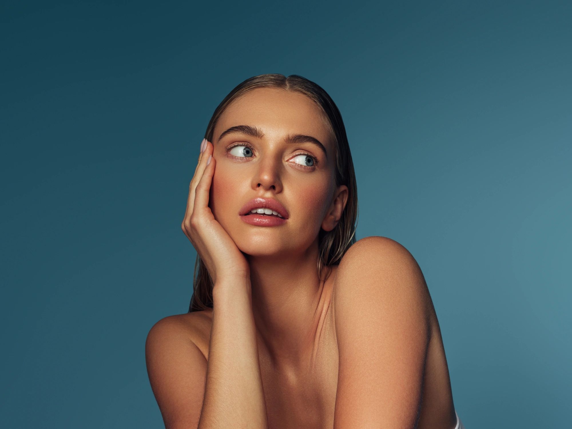 Woman with glowing skin and natural makeup