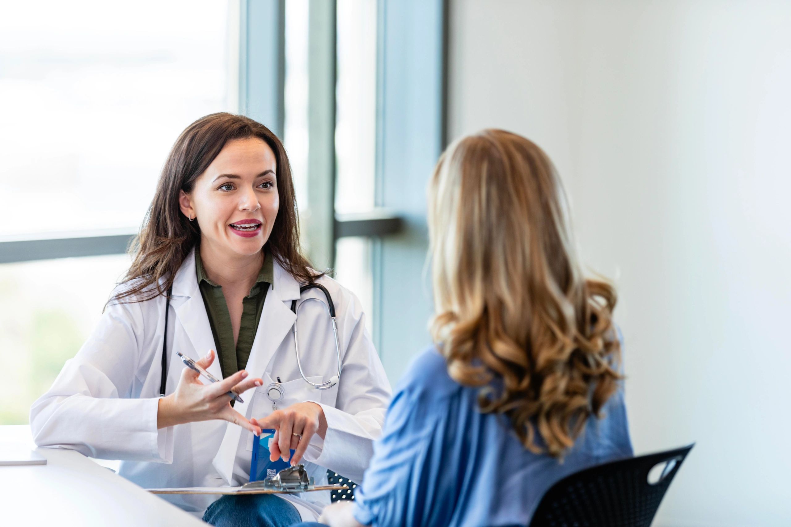 Doctor consulting with a patient at a skincare clinic