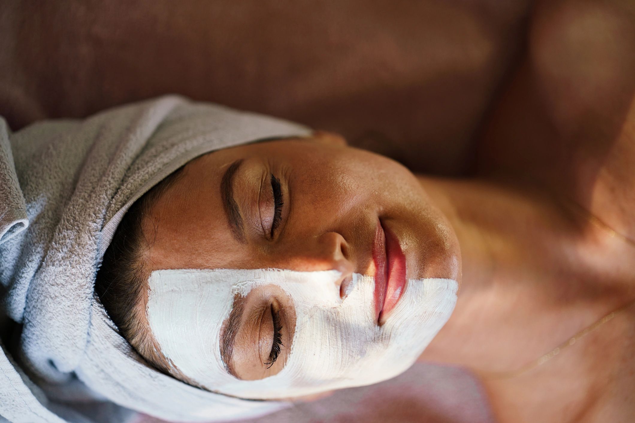 Woman receiving a relaxing facial mask treatment